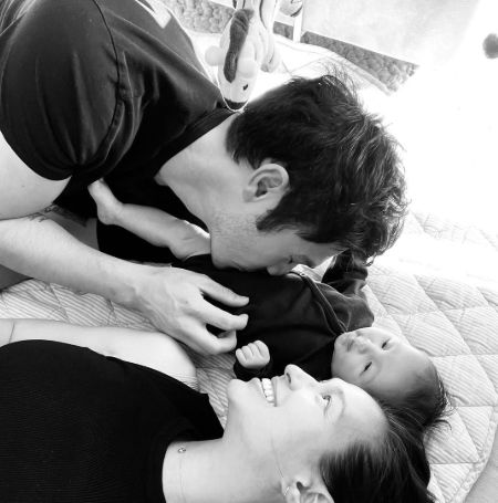 Henry Golding with his wife Liv Lo and their daughter.